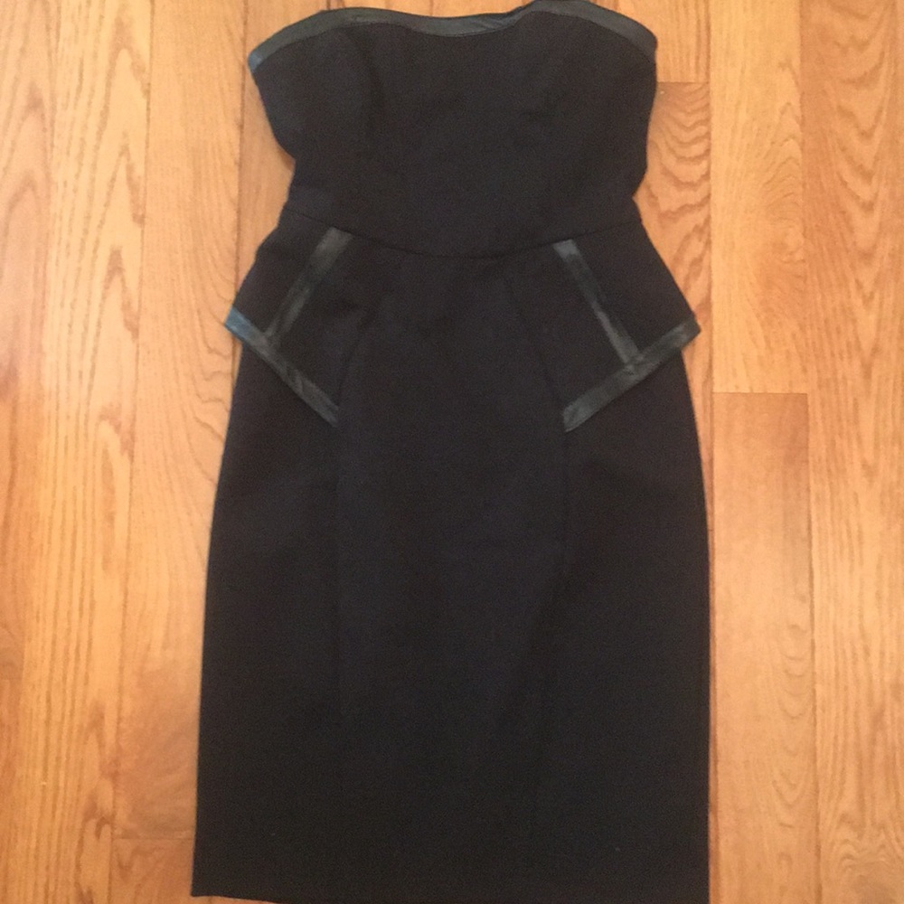 ABS strapless peplum dress with leather trim